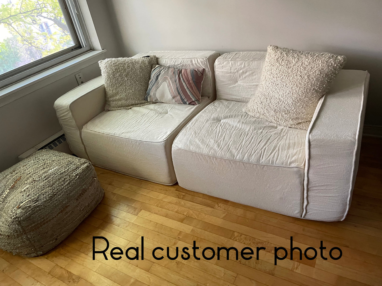 Beige sofa with wooden floor