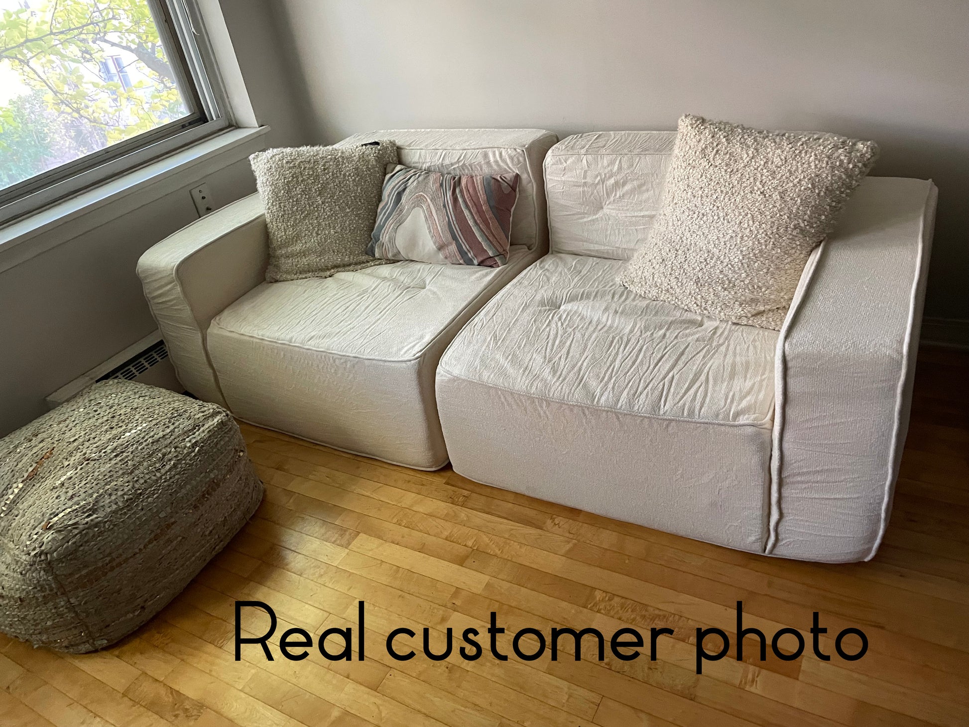 Beige sofa with wooden floor